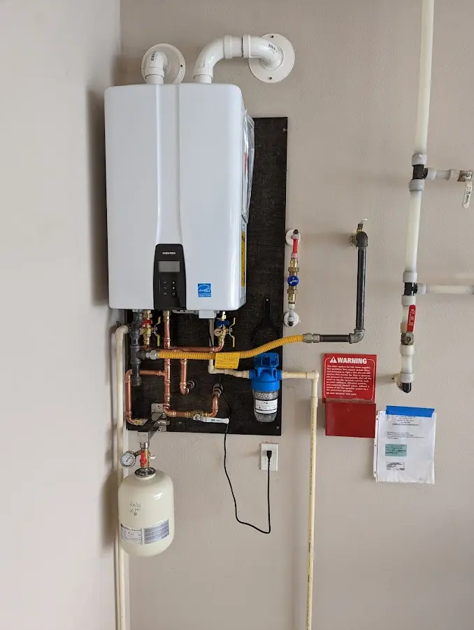 Professional plumber installing copper piping in a Wailua Homesteads home